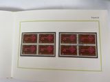 an open book with a picture of two stamps on it