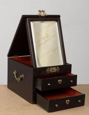 a small wooden box with three drawers and a mirror