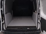a white van with its doors open in a parking lot