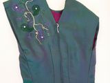 a picture of a purple and green dress on a mannequin mannequin mannequin mannequin mannequin mannequin manne