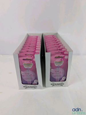 two boxes of pink soap sitting on top of a white table