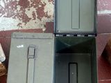 two boxes sitting on the floor next to each other