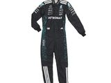 a black race suit with a green and white logo on the chest
