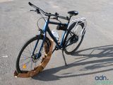 a bicycle that is parked on the side of the road