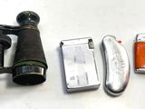 une image représentant une paire de jumelles, un briquet, et un briquet, un briquet
