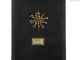 a black framed picture of a snowflake on a white background