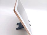 a tablet that is sitting on a stand on the table