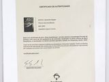 certificate of authenticity of autographs for a car in a white frame