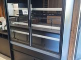 an image of a refrigerator in a kitchen with a lot of shelves