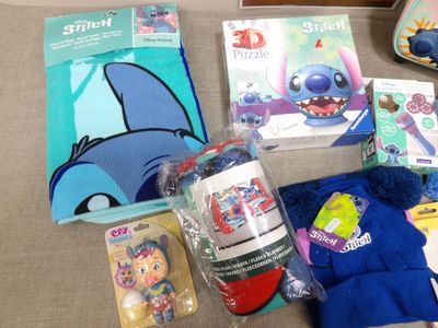 a lot of items that are sitting on a couch