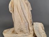 an image of a dress and hat on a mannequin
