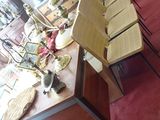 a table that has a bunch of chairs on it
