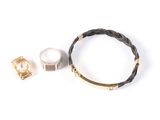 three pieces of jewelry including a watch, bracelet, and ring