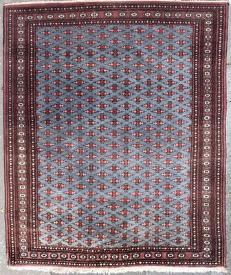 a blue and red rug with a pattern on it