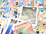 a pile of comic books on a table