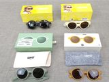 several pairs of sunglasses, sunglasses, a case, and a pair of glasses