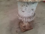 a dirty toilet sitting in the middle of a dirty floor