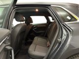 the back seats of a car with the door open in a car showroom