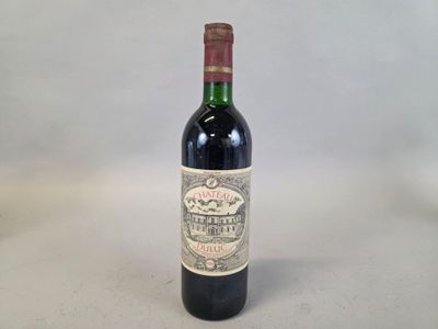 a bottle of wine that is sitting on a table
