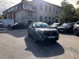 a car parked in front of a building with cars parked in front of it