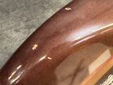 a close up of a piece of chocolate cake on a table