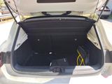 a trunk of a car with a laptop in it