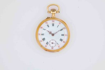 an old gold pocket watch with roman numerals and roman numerals on the face