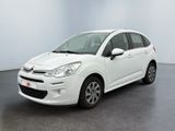 the white citrole is parked in a large room