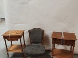 three chairs and a table in the corner of a room