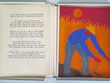 un livre ouvert dans lequel figure l'image d'un homme tenant une pelle