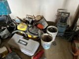 a pile of tools and other items in a room