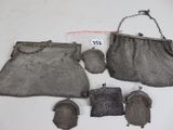 an image of a group of metal mesh purses on a table