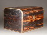 an old wooden box sitting on top of a white surface