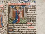 an open book with a picture of a man holding a sword