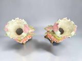 pair of pink and white vases with flowers on them