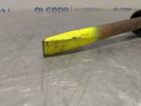 a yellow hammer sitting on top of a metal table