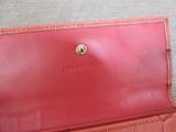 an image of a red purse sitting on top of a table