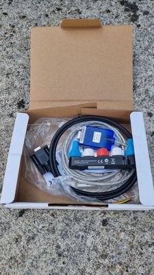 an open box with a cable and a cable connected to it