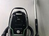 a vacuum that is sitting on the floor next to a pole