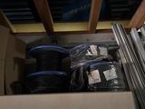a lot of wires in a box on the floor
