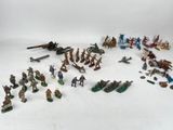 many figurines of different types and sizes on the table