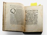 an open book with a picture of the letter q on it