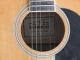 a close up of a guitar with a label on it