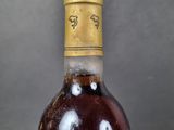 a bottle of wine that is sitting on a table