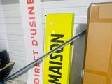 a large yellow sign that is on the side of a building