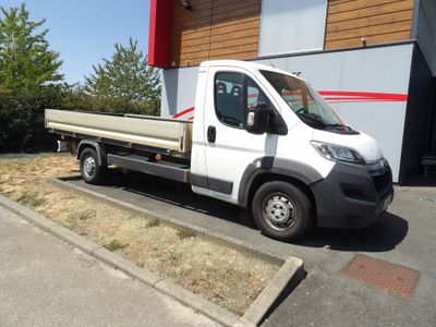 a white truck that is parked in front of a building