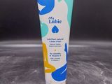 a tube of hand cream sitting on top of a table