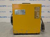 a close up of a yellow machine on a table in a room