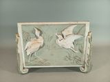 two birds that are sitting on a table