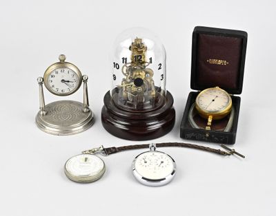 many different types of clocks on display in a case